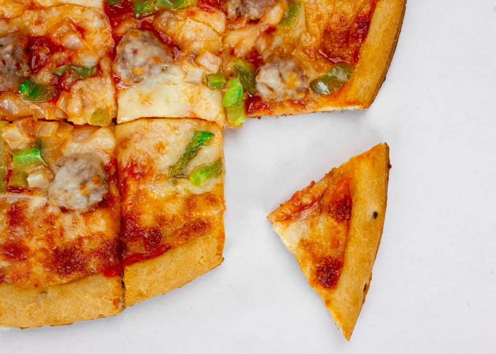 Pizza fresh from the oven, ready to slice