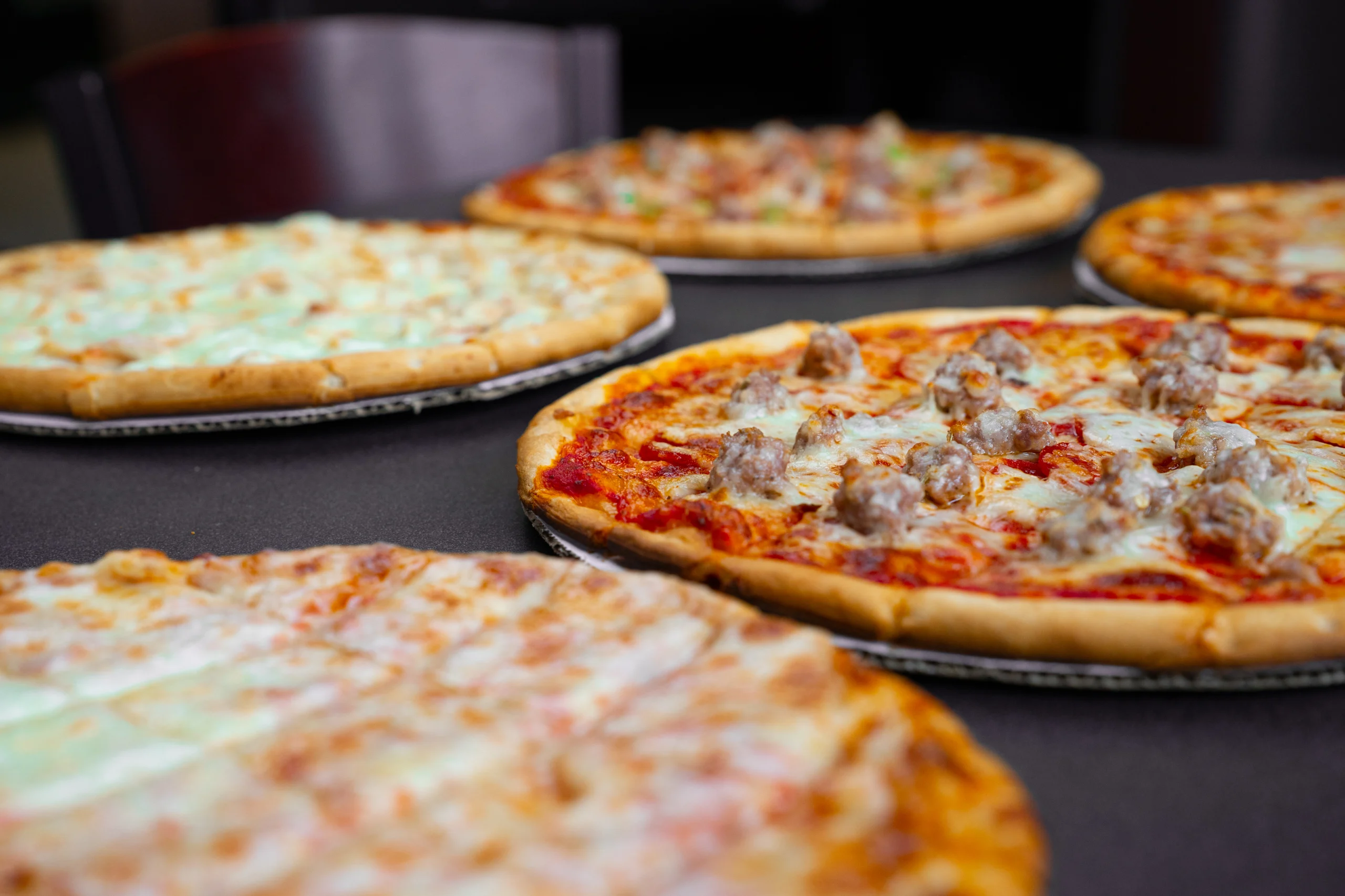 A pair of Sammy's frozen pizzas, fresh from the oven.